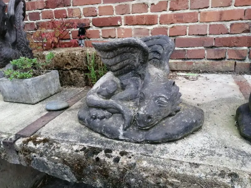 Product image 1 of the product “Lying Dragon on stone, ca. 50 cm L antique finish, pressed stone ”